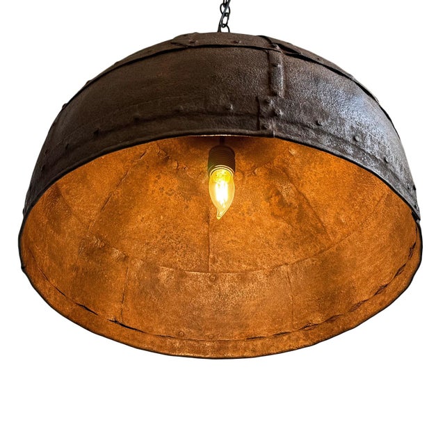 Vintage iron pendant light crafted from a hand-forged bowl from early–mid 20th century India. Such vessels were...