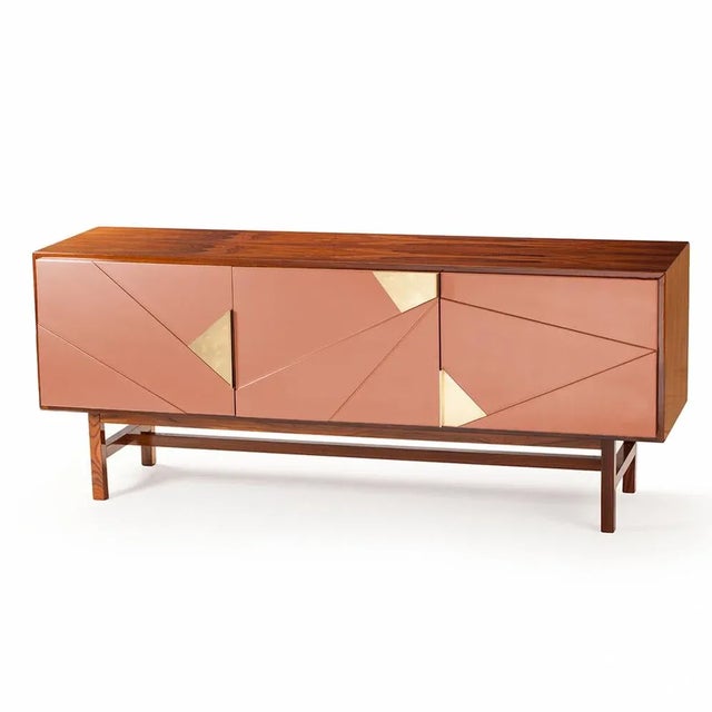 This jazz sideboard comes with natural oak and ivory lacquered mdf structure and polished brass applications. this piece...
