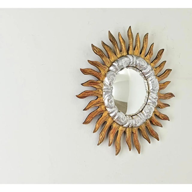 This 19th century Italian convex starburst mirror has undeniable energy that lights up a room. Exposed red bole enhances...