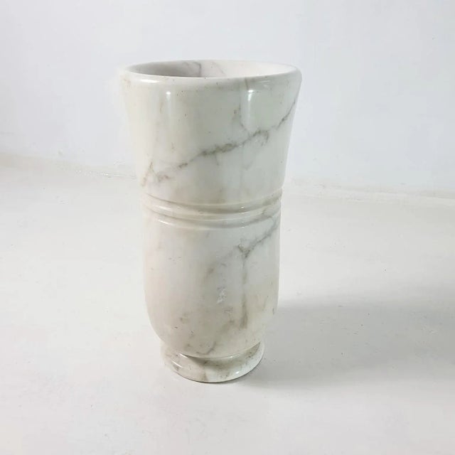 Elegant 1950s umbrella stand made from one piece solid carrara marble with a a copper insert to collect water. This...