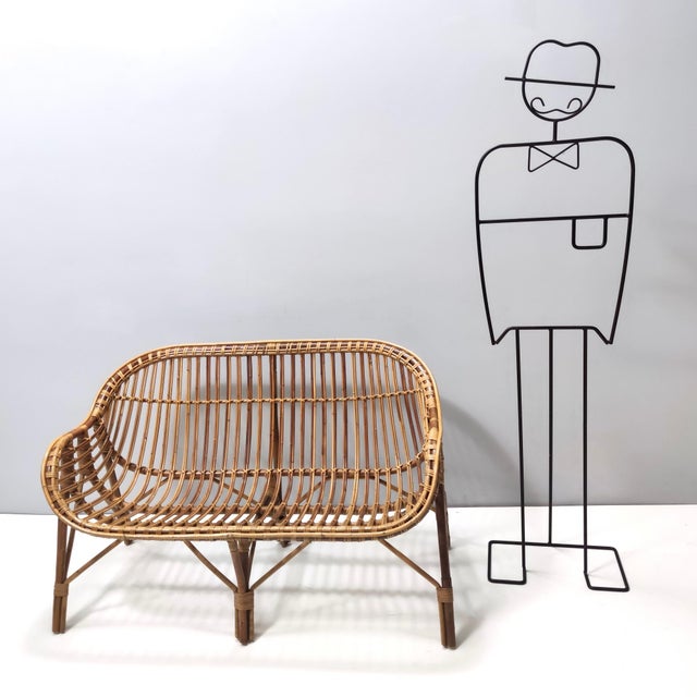 Made in Italy, 1960s. It is made in bamboo. This sofa is a vintage item, therefore it might show slight traces of use, but...