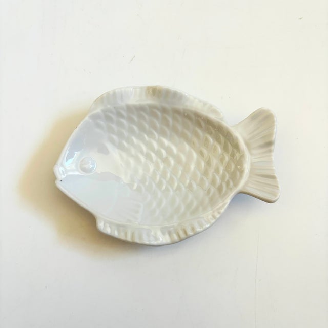 A small vintage ceramic fish tray. Finished in a glossy white glaze. Made in Japan, original sticker attached to the...