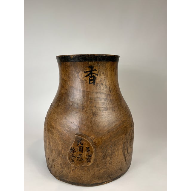 Asian wooden vessel. Visible main body has been been from 1 piece of wood with the base being fitted inside, underneath.