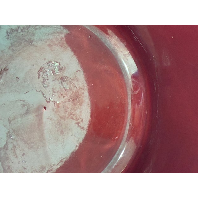 Vintage ceramic planter made by Artmark Portugal featuring a rich red glaze and faceted mid-century form. This piece has a...