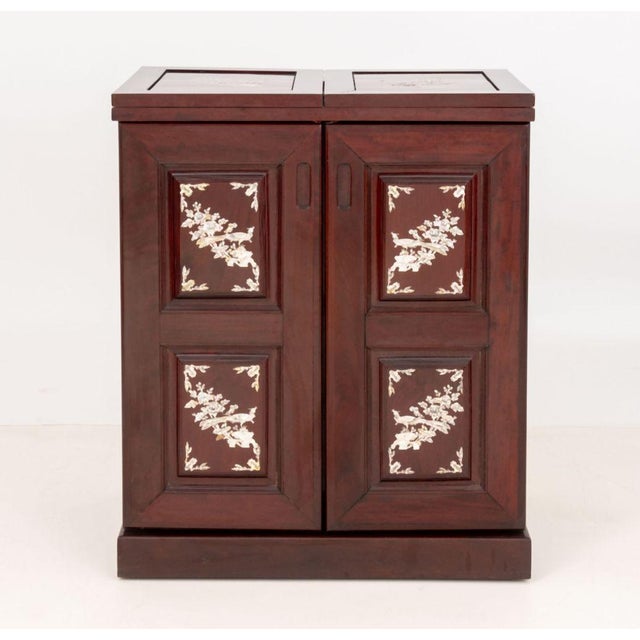Chinese Mother-of-Pearl Inlaid Rosewood Bar Cabinet, with animal and landscape inlaid scene, the flip-top and two-doors...