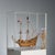 Hand-built wooden vessel presented in a acrylic glass case. This model represents the Dutch vessel Half Moon, famous for...