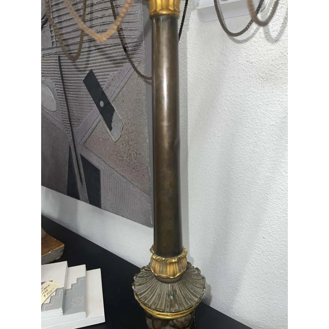 A lovely bronze neo classical lamp with cherubs adorning the base and faux oil lamp cups on top. Exquisitely detailed...