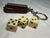 The antique travel dice holder keychain is a unique and vintage accessory for gambling collectors. Made in the United...