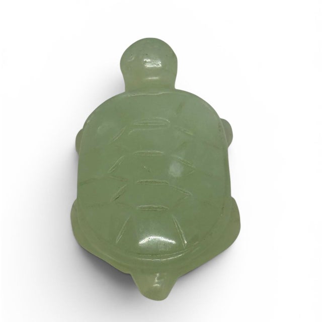 This vintage hand-carved translucent light green nephrite jade turtle tortoise figurine is a unique piece that showcases...