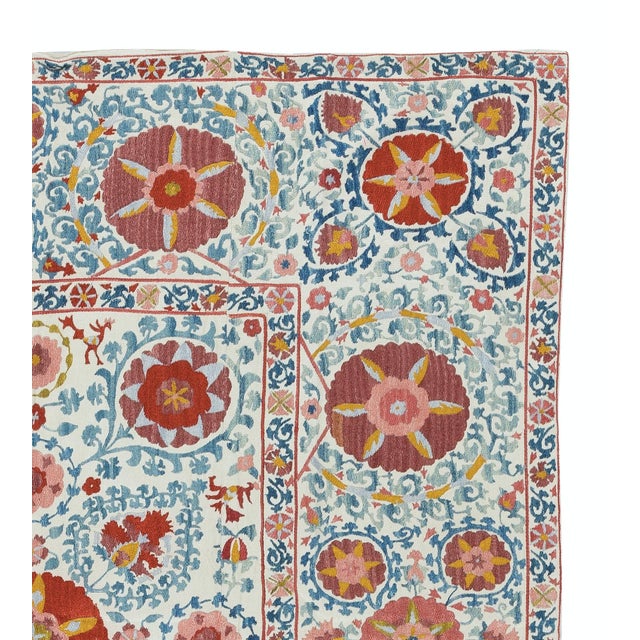 Introducing our exquisite new suzani hand embroidered wall hanging, a captivating piece that combines ancient...