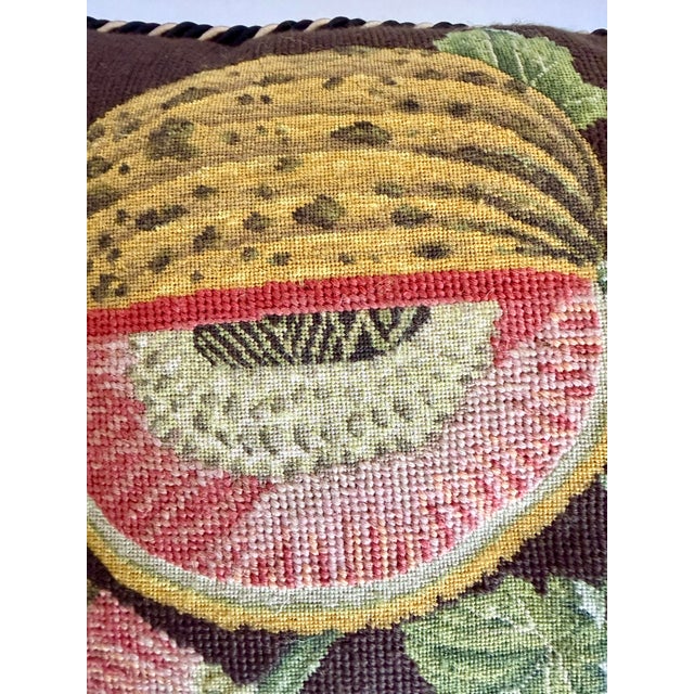 Here is a beautifully executed vintage needlepoint pillow featuring the classic “Golden Melon” motif, with a richly...