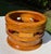 Handcrafted monkeypod wood bowl by Hugh James MacDonald Jr., featuring a substantial rounded form with an open geometric...