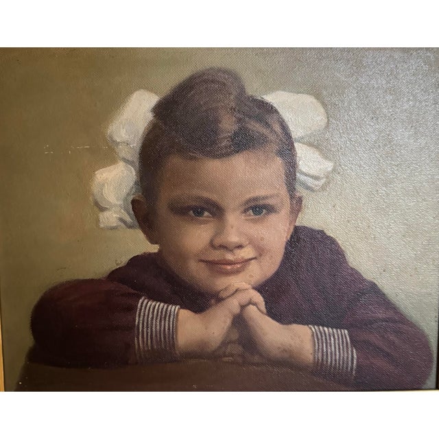 Charming circa 1963 portrait of a young girl, beautifully presented in an ornate gilt frame. The sitter rests her chin on...