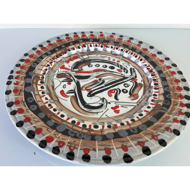 Available for sale this fantastic Vintage hand painted abstract design decorative ceramic plate. Hand signed on the bottom...