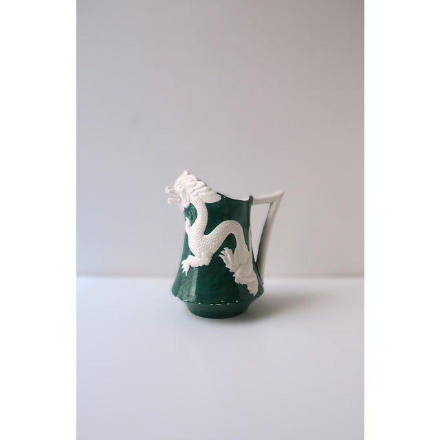 An Italian Emerald‑Green pitcher vase with white dragon relief, Baroque Revival style. circa mid-20th century, Italy. In...