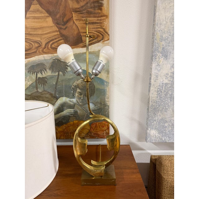 A nice 1970’s era vintage brass lamp designed by Willy Daro. It is in good vintage condition. We have not polished it. We...