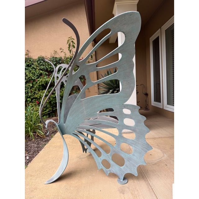 This is a unique butterfly chair featuring an artistic and whimsical design that mimics the delicate form of a butterfly....