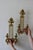 A magnificent brass wall sconce with artwork detailing. In very good vintage condition. Available a single sconce or as a...