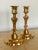 A pair of gilt bronze candlesticks. Each stick cast in three separate ports. From France in the early 18th century.