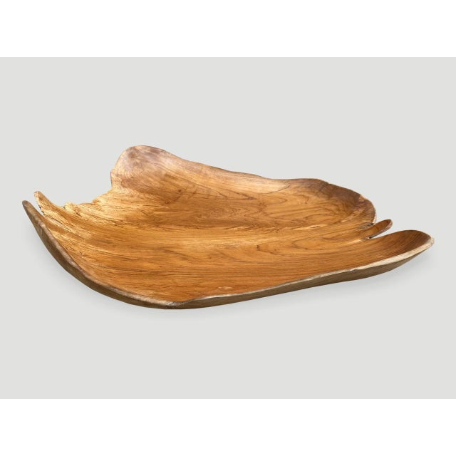 Beautiful grain on this minimalist teak bowl, hand carved from a single piece of reclaimed teak wood. This bowl or tray...