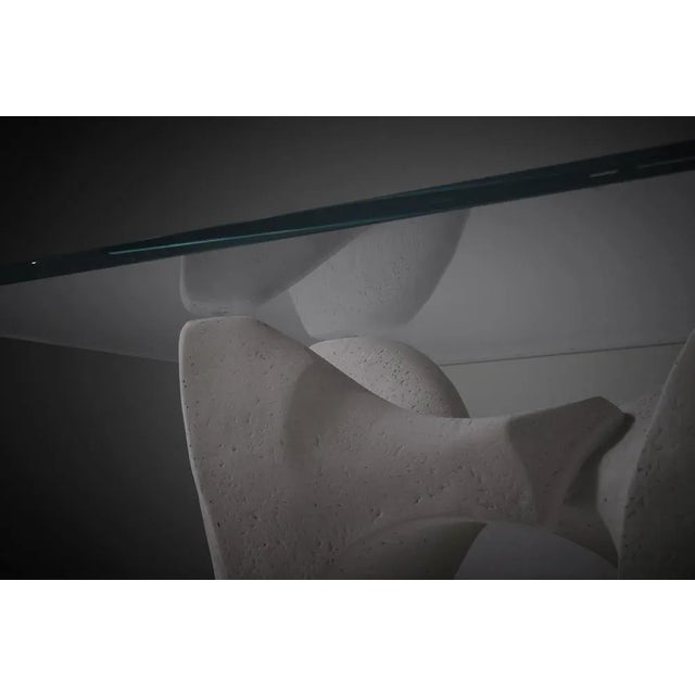 Organic sculptural concrete coffee table, Italy 1970s. The base is showing strong bulky organic shapes which flow over...