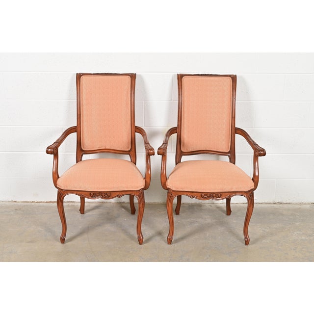 An outstanding pair of French Rococo or French Provincial Louis XV style armchairs or dining captain chairs By Baker...