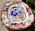19th Century white ironstone platter with colors of rich blue, red, and orange. Marked and impressed to underside.