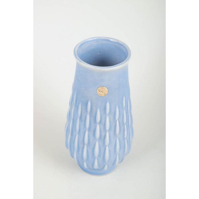 Ewald Dahlskog for Bo Fajans. Vase, 1930/40s. Handmade faience vase in light blue glaze with relief decoration and...