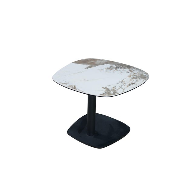 The Lerin End Table by Scandinavian Design exemplifies refined elegance with its sleek black metal pedestal base paired...