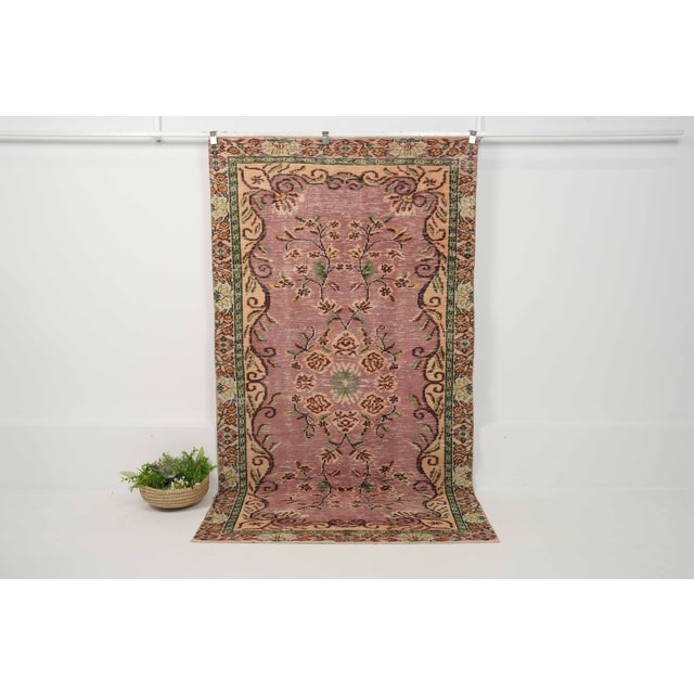 Vintage Hand-Knotted runner rug is a semi-antique vintage area rug. The '70s Eastern region of Anatolia's unique rug is...