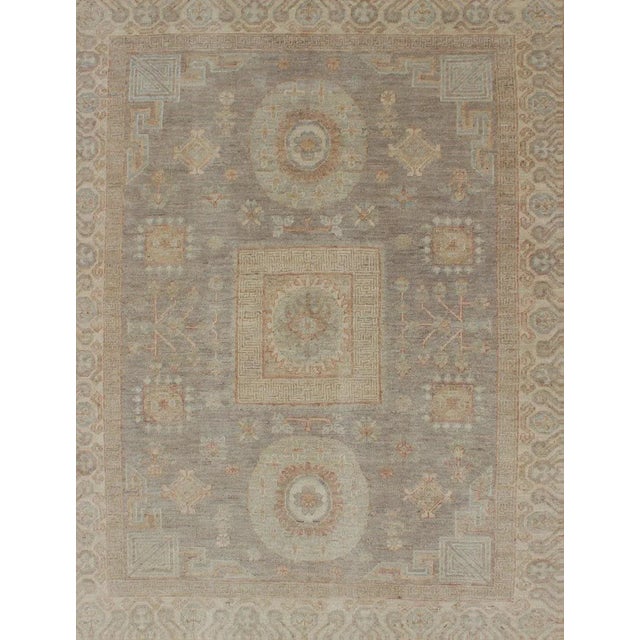 Light color Khotan rug with geometric Medallions in Gray, Tan, pale green, rust and light blue, rug/ country of origin /...