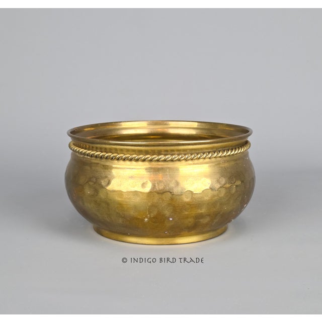 This planter is made from solid hand-hammered brass. Good condition with age-related wear. Approximate measurements: 5.5"...