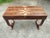 Desk in highly figured feather crotch walnut in an open minimalistic design. Superbly book matched patterns revealing the...