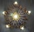 Ceiling lamp. Made in Spain in the 1950s. Features floral motifs and is made of iron with a gold finish. Total dimensions:...