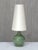 This rare table lamp was designed by carl-harry stålhane and produced by rörstrand in sweden in the 1950s. The piece is...