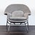This lounge chair features a soft gray fabric, plush seat and back cushions, and sturdy metal legs. Its wide, curved back...