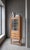 Oak corner cabinet attributed to Danish designer Henning Kjærnulf, crafted in Denmark during the 1960s. Designed in a...