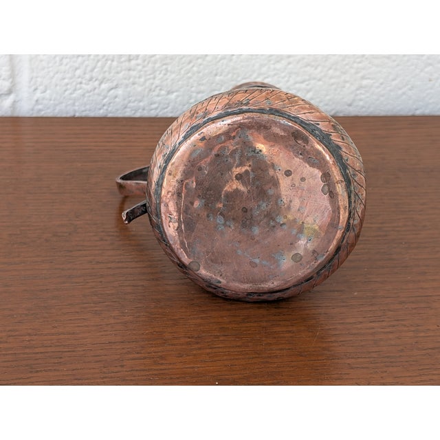 An exceptional find for collectors of fine antiquities, this authentic 19th-century Middle Eastern tinned copper coffee...