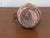 An exceptional find for collectors of fine antiquities, this authentic 19th-century Middle Eastern tinned copper coffee...