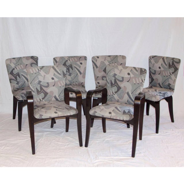 Refinished and reupholstered in the early 90's by the previous owner. The wood is finished in very dark brown color....