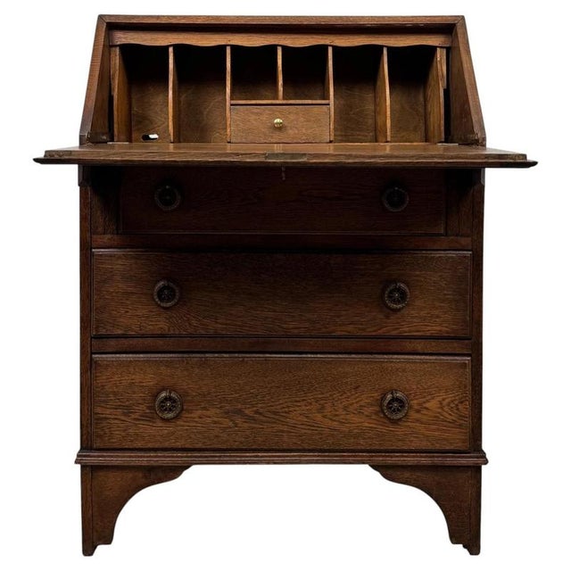 A handsome and beautifully crafted early 20th-century English Edwardian bureau, constructed in richly figured oak and...