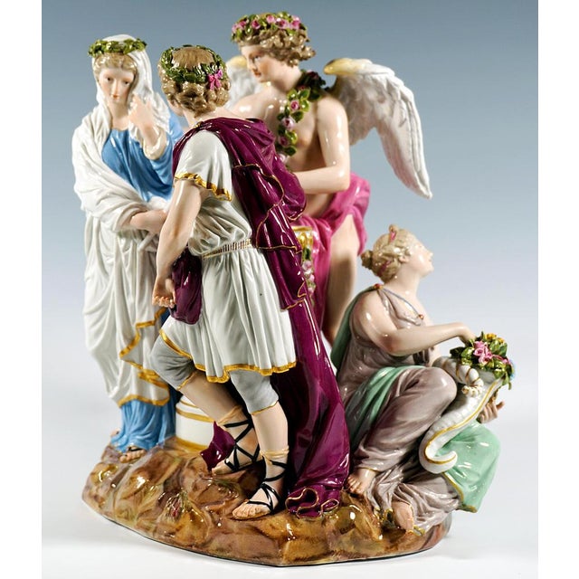 Exceptional rare meissen porcelain group: a group of three figures in elaborate rococo attire: the young, pretty lady in a...