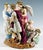 Exceptional rare meissen porcelain group: a group of three figures in elaborate rococo attire: the young, pretty lady in a...