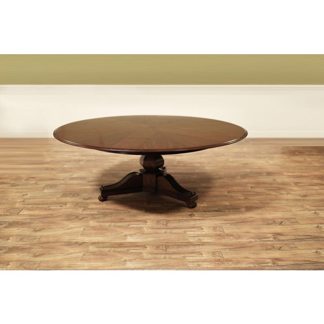 Antique Reproduction Jupe Table with lion paw feet. This table can be used at 62-inches round, or it can be expanded to...