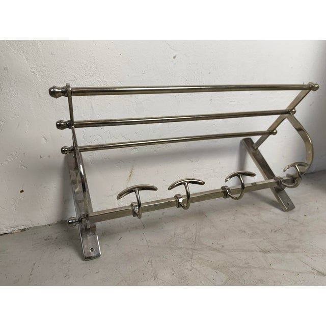 Beautiful chrome-plated decorative wall-mounted coat rack in Art Deco style, in good used condition.