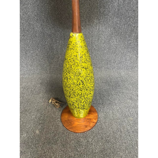 Here is an amazing and rare Mid Century floor lamp. Lamp is made of solid walnut and green speckled ceramic. Lamp has a...