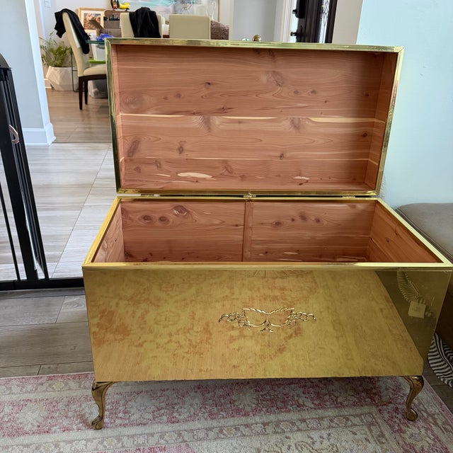 Make a spectacular, high-gloss statement with this gorgeous vintage mid-century Hollywood Regency campaign-style storage...