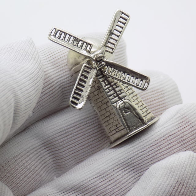 A windmill miniature crafted in Italy during the 1980s or 1990s. The piece is hallmarked 800 which stands for Continental...