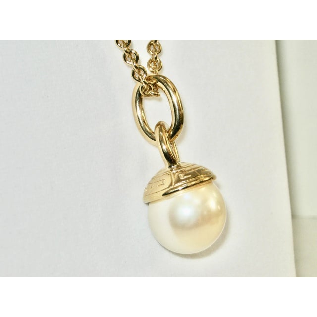 This is part of Chairish’s Costume Jewelry assortment. Gorgeous Givenchy 1980s embossed/carved logo glass pearl enhancer...