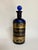 Rare late 19th-century apothecary bottle in deep cobalt blue glass, retaining its matching ground glass stopper and...
